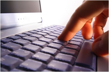 Finger typing on the keyboard.